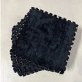 Tapis mousse puzzle noir, parfait pour une salle de jeux ou un studio avec un design contemporain.